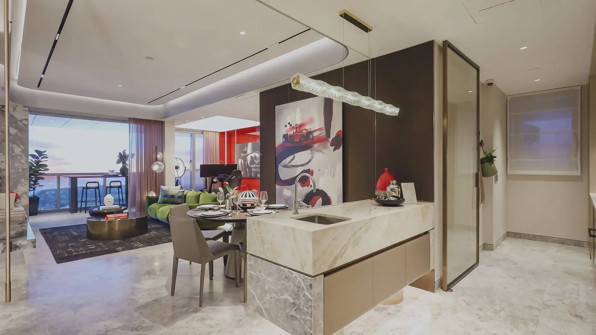 A three-bedroom kitchen island and dining area in the showflat